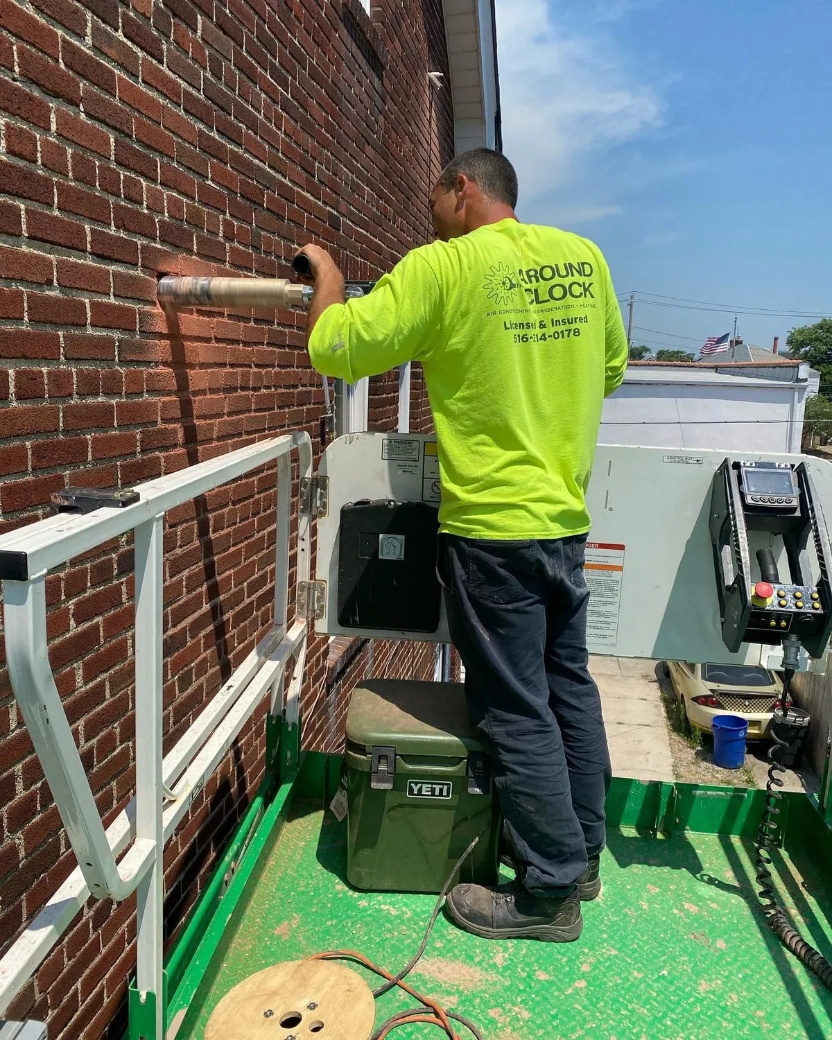 Around The Clock HVAC technician working on a heating and cooling system on Long Island